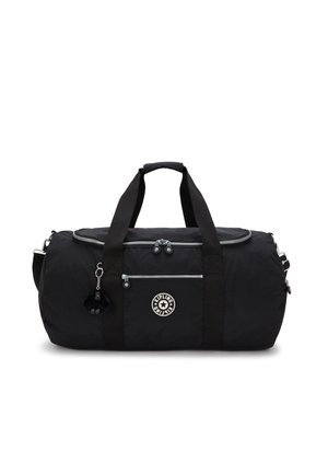 Black duffel bag made of nylon with dual handles, a detachable shoulder strap, and a front zip pocket. Features a logo and a furry keychain.