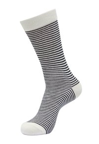 Stripete sokker i svart og hvitt, laget av vevd stoff. Har en hvit mansjett og en forsterket tå. Loddrette striper varierer i bredde.