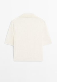 Kortærmet skjorte med krave i struktureret hvidt stof med strikmønster, der har en afslappet pasform og et rent, enkelt design.