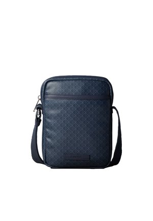 Petit sac bandoulière bleu foncé compact avec sangle ajustable, motif subtil, poche avant zippée et patch logo Calvin Klein.