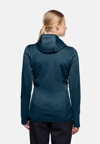 Sportieve hoodie in donkergroen, met een textuurstof, een aansluitend ontwerp en lange mouwen met duimopeningen.