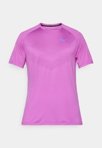 Nike short-sleeve shirt in bright pink, featuring a textured pattern on the chest and a blue logo on the left side. Lightweight fabric.