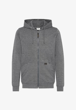 Grå hettgenser med glidelås laget av mykt stoff, med hette, frontlommer og et lite logomerke på venstre lomme.