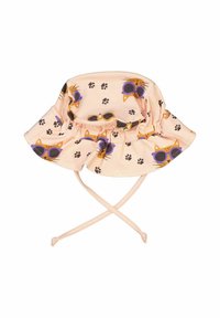Persikofärgad bucket hat med katt- och tassavtrycksmönster, med en vågig skärm och justerbara snören för fäste. Tillverkad av mjukt tyg.