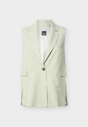 Ermeløs lys grønn blazer med hakkede slag, enkelt knappelukking, fremre klafflommer og sidesplittelser.