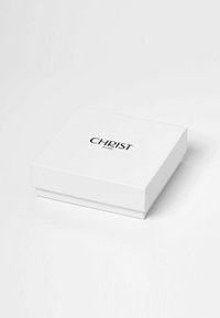 Witte vierkante sieradenbox met zwart "CHRIST seit 1863" logo, gecentreerd op de deksel, geplaatst op een witte ondergrond.