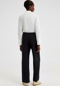 Touché Privé EMBROIDERED - Püksid - black