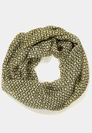 Lightweight yellow scarf with black and white geometric zigzag and diamond patterns, arranged in a loose circular shape.