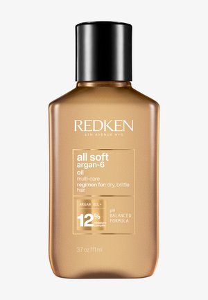 Redken All Soft Argan-6 Oil dans une bouteille en plastique translucide dorée avec un bouchon noir. Présente une étiquette de produit et des détails en texte blanc et doré.