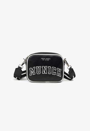 Black rectangular bag with white piping, featuring bold white text "MUNICH SPORTS." Includes adjustable strap and metal hardware details.