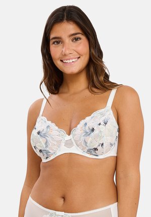 Soutien-gorge en dentelle blanche avec des broderies florales dans des couleurs pastel, doté de bretelles ajustables et d'un petit nœud au centre.