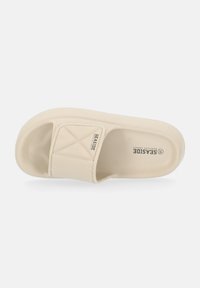 Infradito beige con una fascia testurizzata che presenta un motivo trapuntato, design open toe e suola spessa e imbottita.