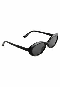 Lunettes de soleil en plastique noir avec des verres ovales et des montures larges. Texture lisse avec des branches incurvées et des verres teintés foncés.