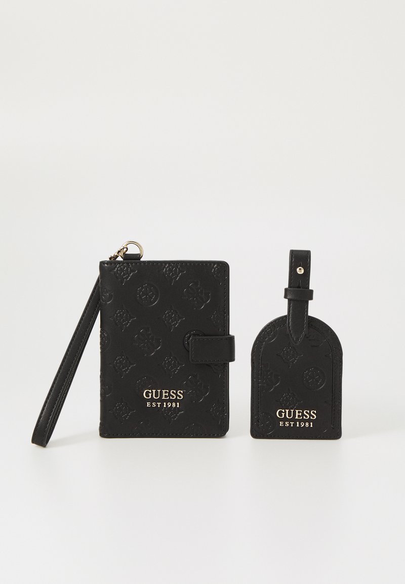 Black wallet and luggage tag set made of textured leather, featuring embossed floral patterns and gold logo detailing.