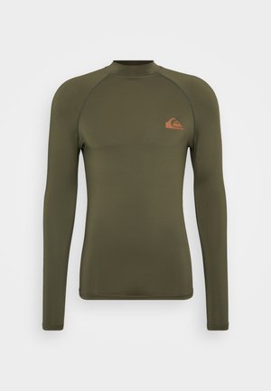 Long-sleeve, olive green rash guard with a high collar, featuring flat seams and a small orange logo on the left chest.