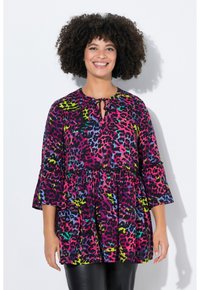 Lila Oberteil mit einem lebhaften Leopardenmuster in Pink, Grün, Blau und Gelb. Mit einem Schlüsselloch-Ausschnitt und weit ausgestellten Ärmeln. Weicher Stoff.
