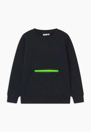 Sweatshirt noir en coton, avec une poche avant dotée d'une fermeture éclair vert fluo. Comprend des poignets et un col côtelés.