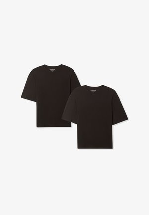 Due magliette oversize a maniche corte in cotone nero. Presentano un collo rotondo e una vestibilità rilassata. Design semplice senza modelli o accenti visibili.