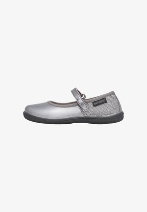 Silver Mary Jane shoes with a textured side panel, elastic collar, and black rubber sole. Features an adjustable strap for fit.