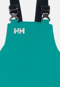 Teal vanntett smekke med justerbare svarte stropper og reflekterende HH-logo nær toppen av midten foran.