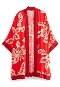 Kimono rouge à motif floral blanc, bordé d'une bordure rouge texturée. Coupe ample, manches mi-longues, tissu léger.
