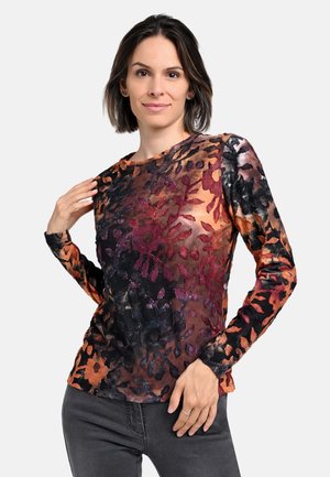 Long-sleeve sheer top featuring a floral pattern in shades of orange, purple, and black, with a round neckline and textured fabric.