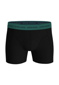 Schwarze Boxershorts mit einem grünen elastischen Bund, auf dem das Logo "BJÖRN BORG" aufgedruckt ist. Glatte Textur und enganliegendes Design.