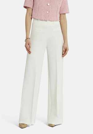 White wide-leg trousers with a smooth texture, featuring side pockets and a fitted waistband, paired with a short pink patterned top.