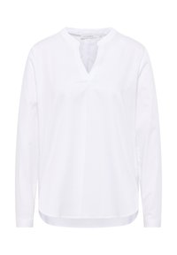 Blusa bianca a maniche lunghe con scollatura a V, realizzata in tessuto morbido, caratterizzata da una vestibilità comoda e un'orlo leggermente curvo.
