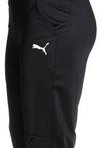 Puma LIGA TRAINING PANTS CORE  - Jogginghose - black/white