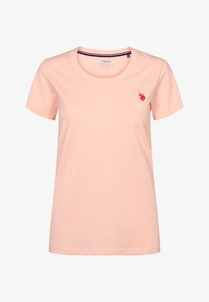 Ljusrosa bomulls-T-shirt med rund halsringning, korta ärmar och en liten röd broderad logotyp på vänster bröst. Mjuk textur.