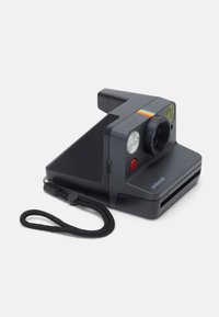 Polaroid camera, rectangular body in matte black, featuring a lens, flash, and red shutter button, with a multicolored stripe on top.