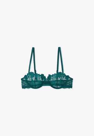 Soutien-gorge en dentelle teal avec des bonnets en mesh transparent, broderie florale, bords scallopés et bretelles réglables. Dispose d'un fil d'acier et d'un design à bande.