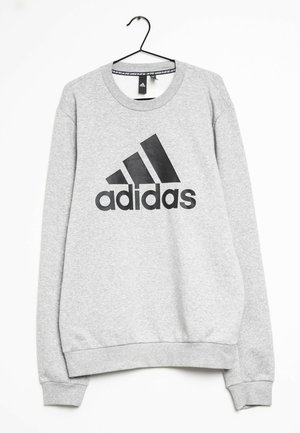 Hellgraues Adidas-Sweatshirt mit schwarzem Logo und Schriftzug, langen Ärmeln, gerippten Bündchen und Saum, an einem schwarzen Bügel vor weißem Hintergrund hängend.