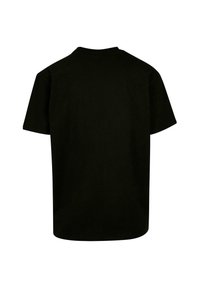 Tricou negru din bumbac cu mâneci scurte, guler rotund și o croială lejeră. Textură netedă și fără modele sau accente vizibile.