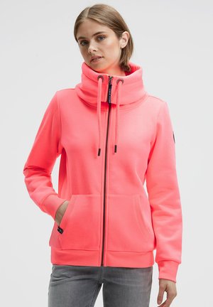Bright pink hoodie featuring a high collar, front zipper, drawstring, and two front pockets. Made from soft, textured fabric.