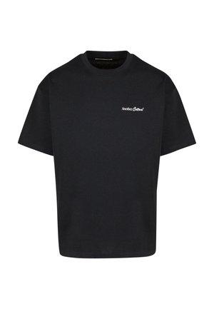 T-shirt in cotone nero con collo giro, maniche corte e un piccolo logo bianco nella zona sinistra del petto. Design semplice e dal taglio rilassato.