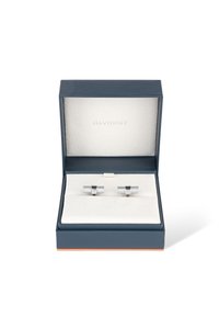 Silberne Metall- Manschettenknöpfe mit einem strukturierten Design, präsentiert in einer dunkelblauen Box mit weißem Innenraum und dem Davidoff-Logo.