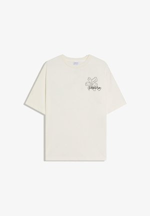 Off-white T-Shirt mit kurzen Ärmeln und rundem Ausschnitt, mit einer schwarz umrandeten Blume und dem Schriftzug „Eternal Joy“ auf der linken Brust.