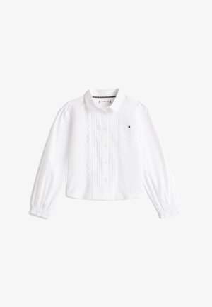 Biała bluzka z długim rękawem, ozdobiona koronką, z guzikami z przodu, klasycznym kołnierzykiem, elastycznymi mankietami i małym logo Tommy Hilfiger na piersi.