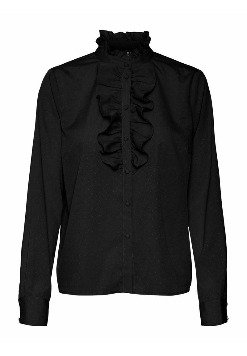 Blouse noire avec un col montant à volants, une patte de boutonnage à l'avant, et une texture subtilement à pois. Manches longues avec poignets boutonnés.