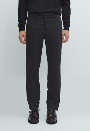 Black tailored trousers made of smooth fabric, featuring a straight-leg design, with a crease down the front and subtle side pockets.