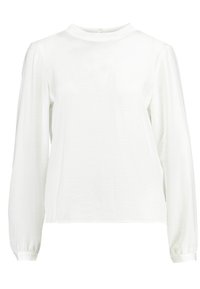 Blusa bianca a maniche lunghe realizzata in tessuto morbido, con un colletto alto e maniche leggermente a sbuffo, dotata di polsini arricciati ai polsi.