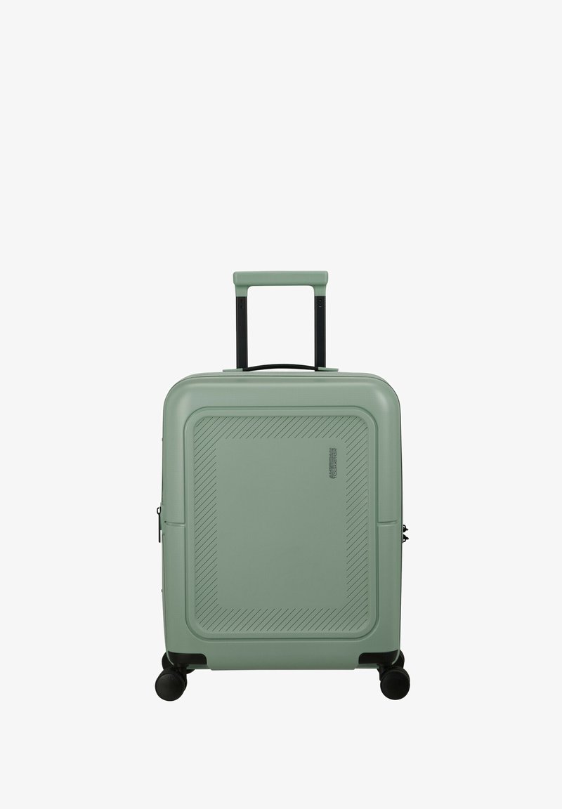 Hard-shell carry-on suitcase in light green. Features a textured surface with diagonal lines, black retractable handle, and 4 spinner wheels.