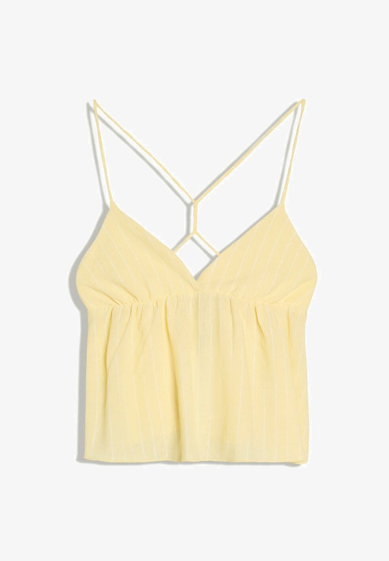 Haut sans manches jaune avec fines bretelles croisées et discrètes rayures verticales, doté d'un corsage froncé et ample.