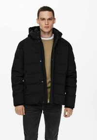 Black puffer jacket with a hood, featuring a quilted design, snap closures, two side pockets, and a soft interior lining.