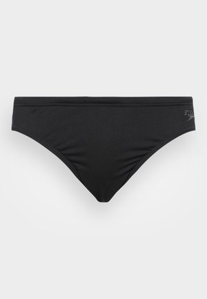 Bas de bikini noir en tissu lisse. Présente un design à taille basse avec une couverture minimale et un discret logo sur le côté.