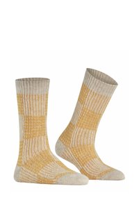 Gelbe und beige gemusterte Socken mit gerippter Textur, die ein kariertes Design sowie verstärkte Zehen- und Fersenpartien aufweisen.
