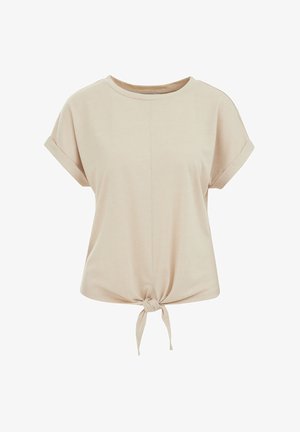 Bež majica kratkih rukava od mekog materijala s okruglim izrezom i čvoranom donjom detalju sprijeda. Glatka tekstura, labav kroj.