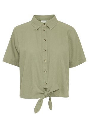Lühikeste varrukatega oliivroheline särk, millel on nööpidest eesmine osa ja sõlmitud lipsu detail allääres; valmistatud kergest kangast, millel on sile tekstuur.